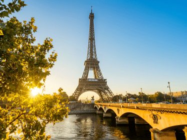 The Eiffel Tower and the Seine in morning sunlight.